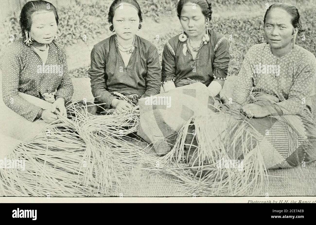. Women of all nations, a record of their characteristics, habits, manners, customs and influence; . L ?^ *i TANJONG WOMEN (SARAWAK, BORNEO) Weaving baskets of bemban grass. The second woman from the right and the woman on the left wear heavybrass ear-rings, which have pulled the lobes of the ears into long loops. 172 WOMEN OF ALL NATIONS threaded innumerable little brass rings; ment until some days or perhaps weeksthe circles are pinned together with brass have elapsed. Since, in addition to therods, and the whole forms a more or less rawai, a Sea-Dayak belle will have also herflexible cylind Stock Photo