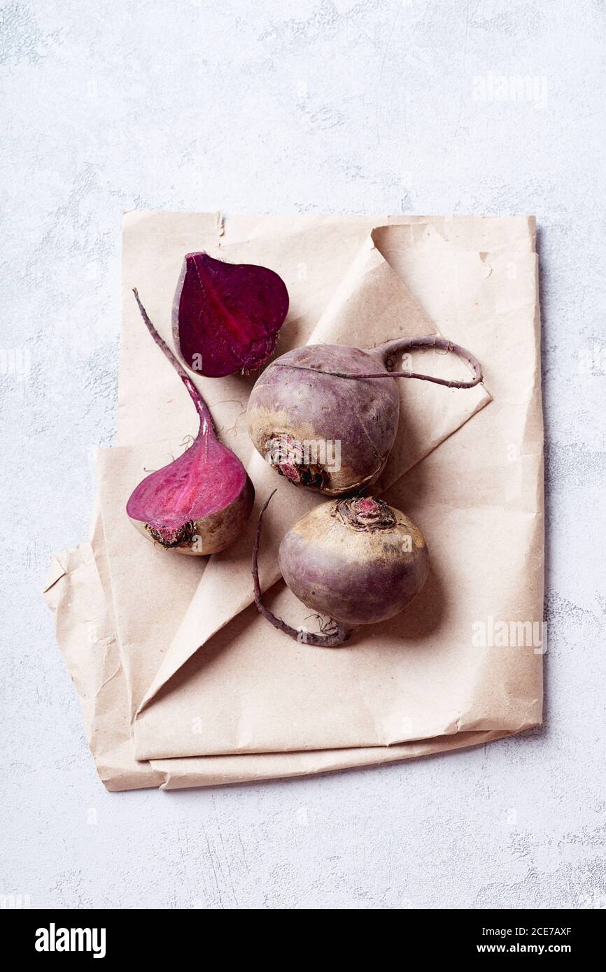 Fresh whole and sliced beetroot viewed from above Stock Photo
