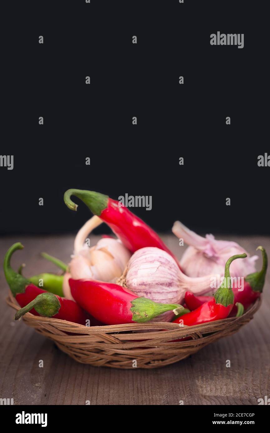 garlic, green and red hot chili peppers Stock Photo Alamy
