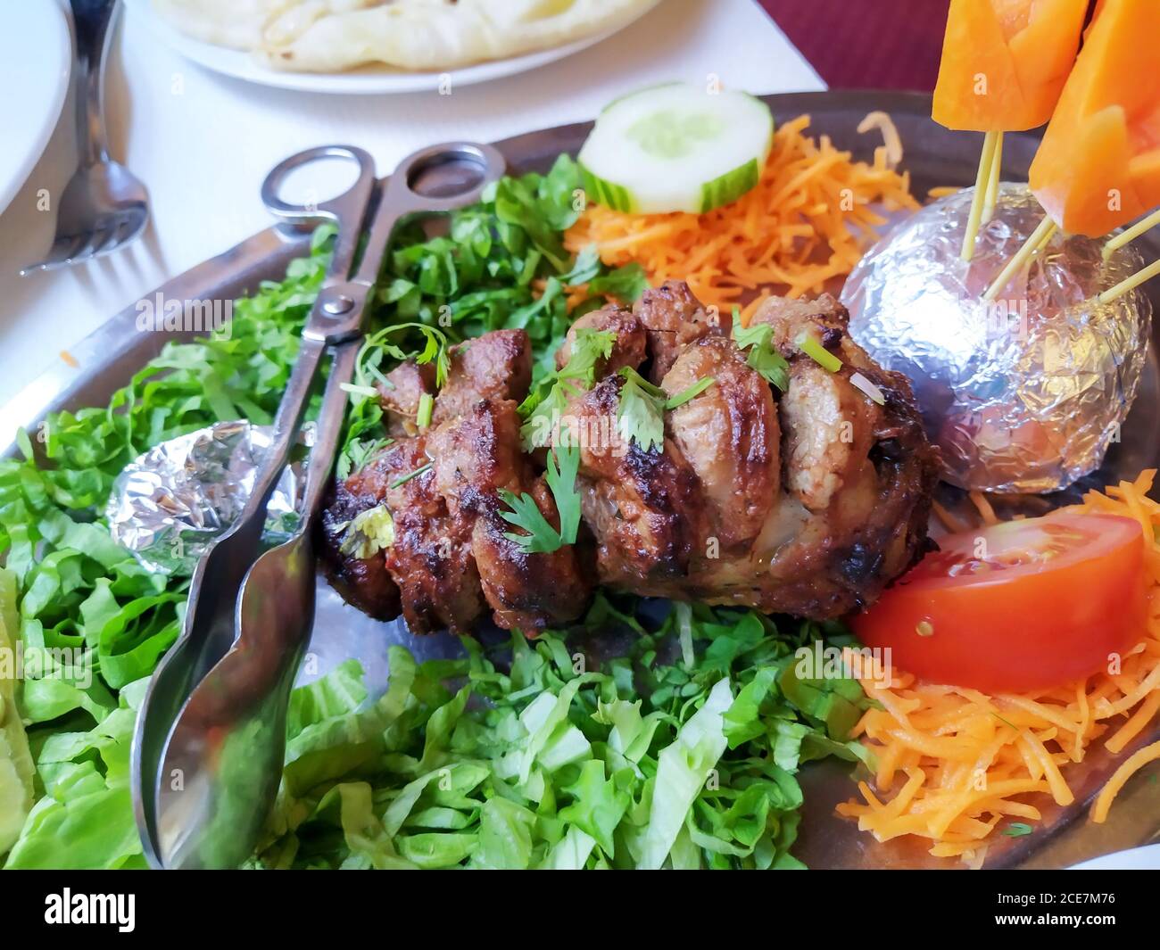 Indian dish Bara Kabab Lamb shank grilled in a tandoori oven Stock