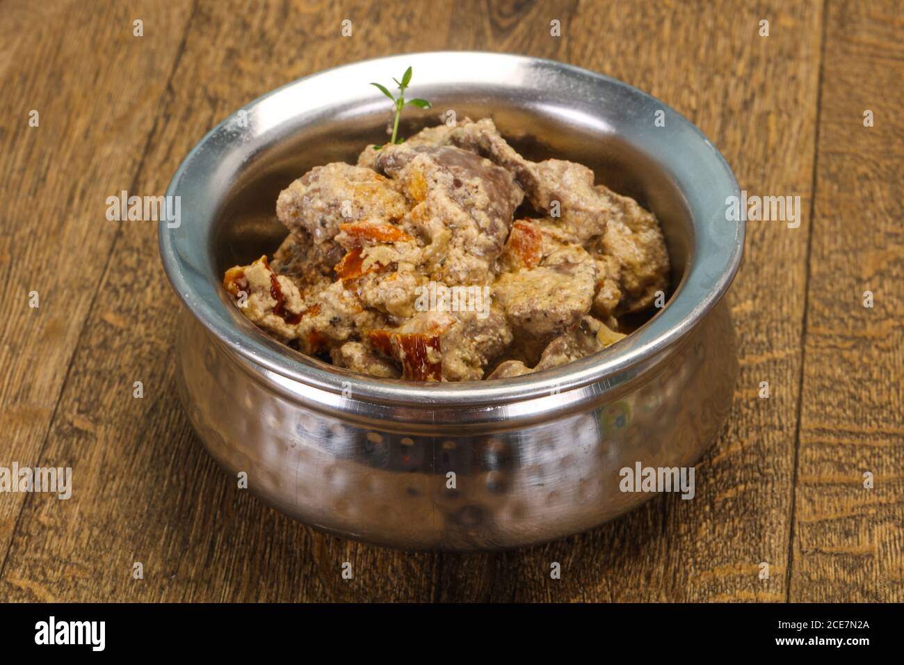 Chicken liver with cream and dry tomatoes served thyme Stock Photo Alamy
