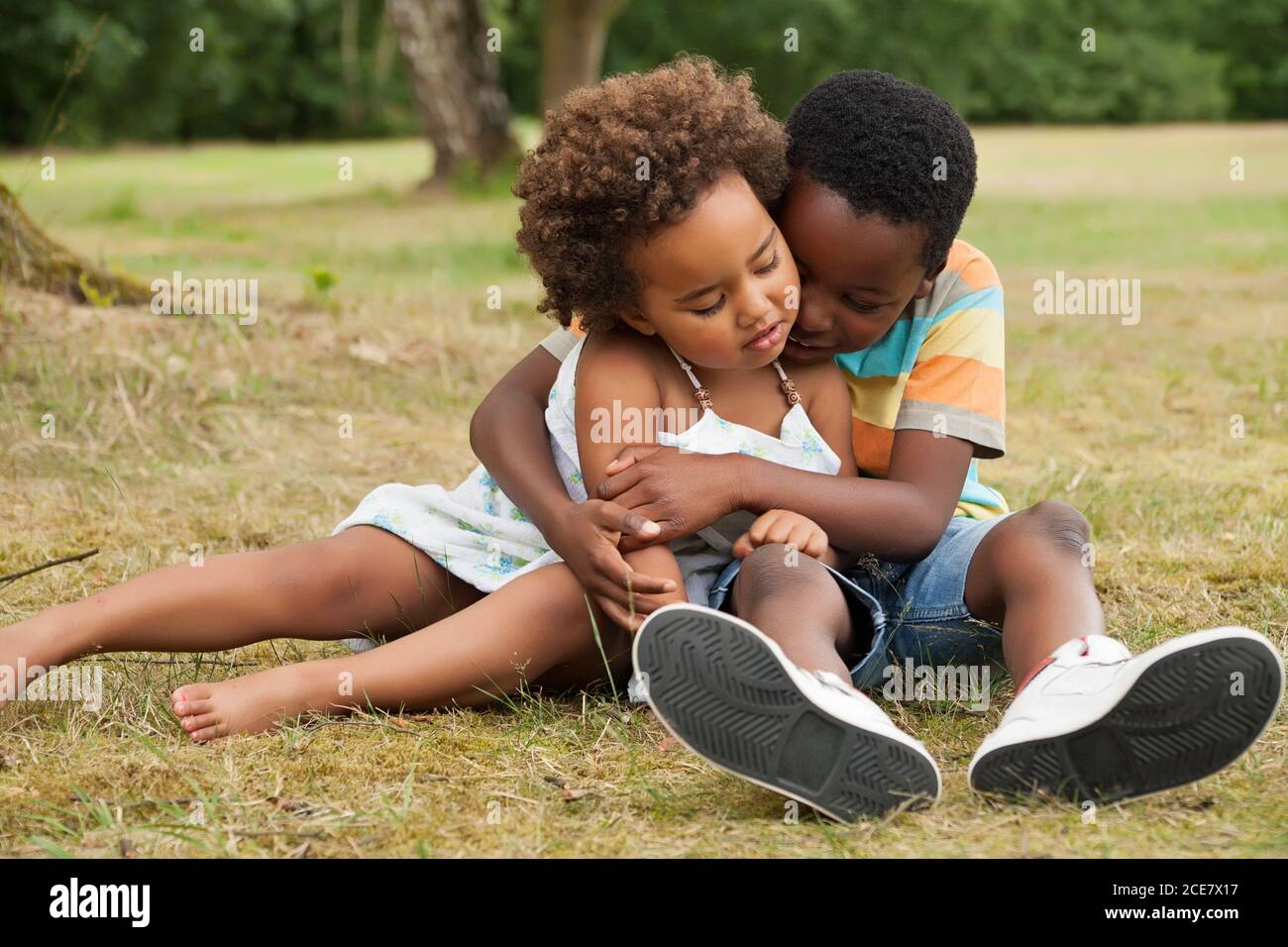 Big brother is caring of his sister Stock Photo
