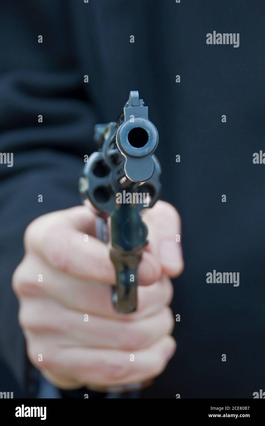 Close up of a pistol gun in the hand of a man Stock Photo