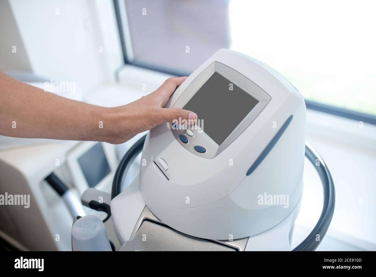 Doctor using a novel professional ultrasound machine Stock Photo