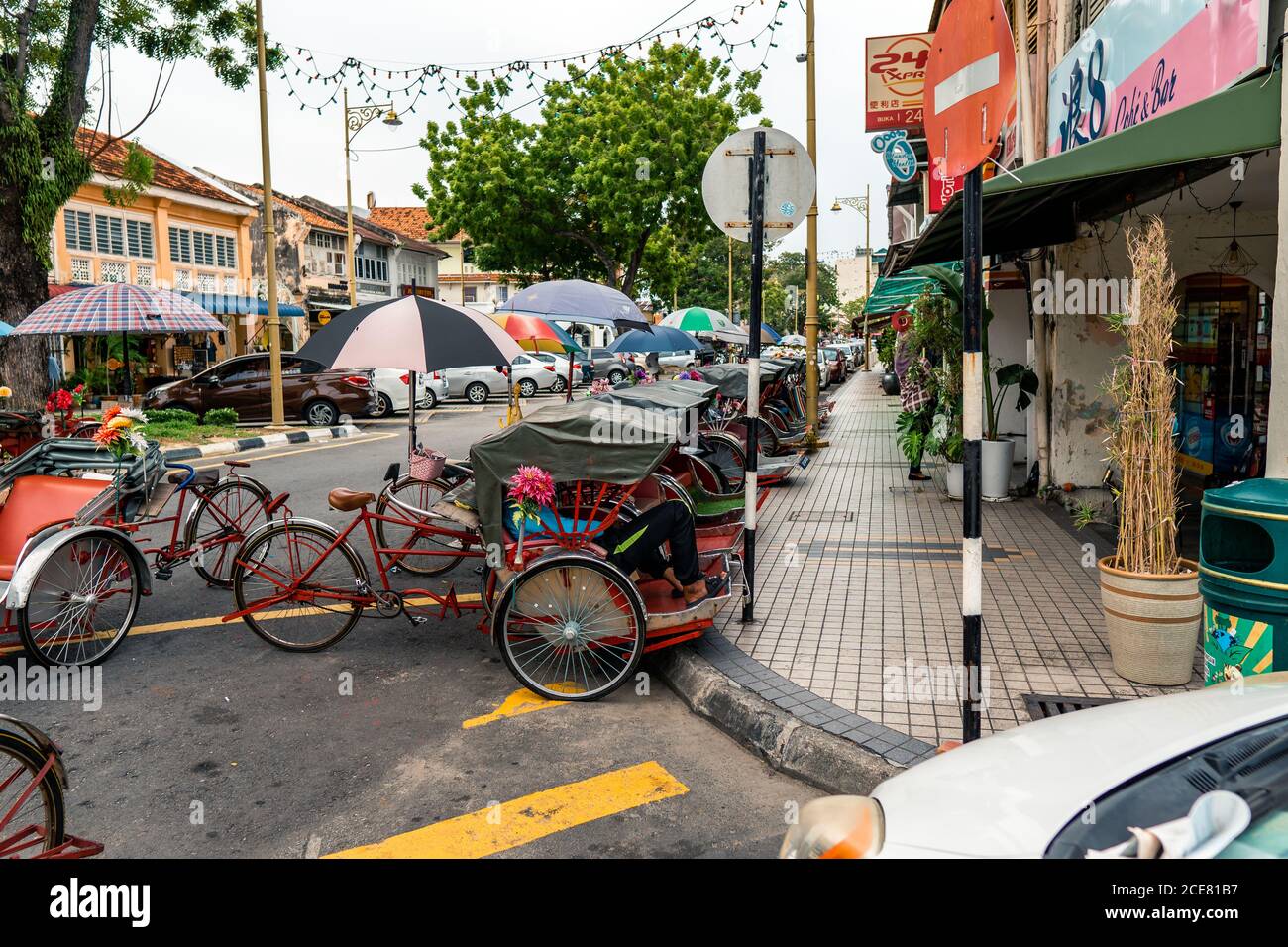 Rickshaws parked on street at George Town in Penang, Malaysia Stock Photo