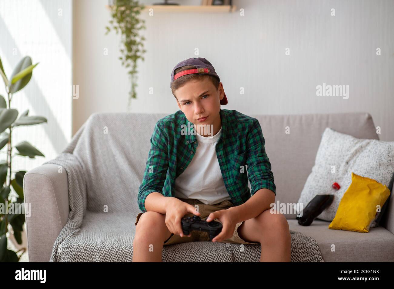 Man Playing Video Games At Home And His Girlfriend Bored Beside Looking At  Him Stock Photo, Picture and Royalty Free Image. Image 52407663.