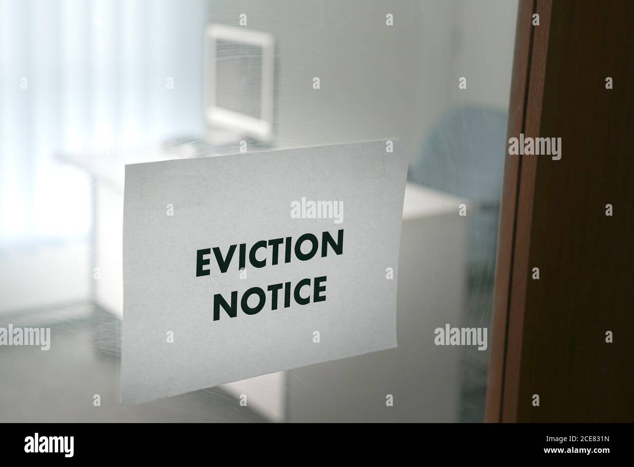 Eviction Notice on office glass door. Stock Photo