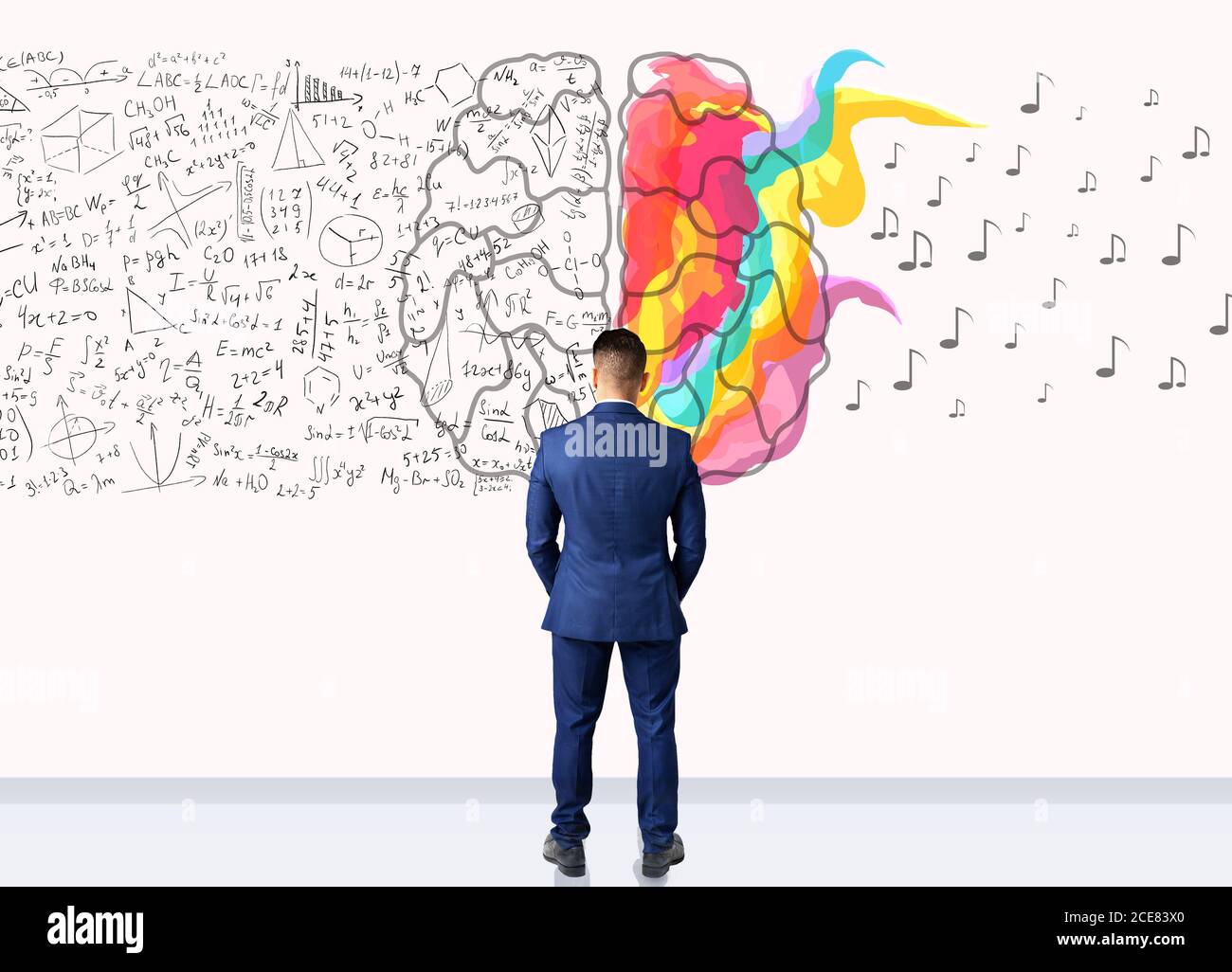 Businessman Standing Over White Background With Brain Halves, Back View Stock Photo