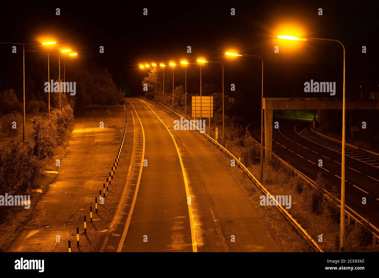 M60 junction 25, sliproad from the Crookilley Way roundabout. The second slip road on the left was originally intended to connect to the unbuilt A6(M) Stock Photo