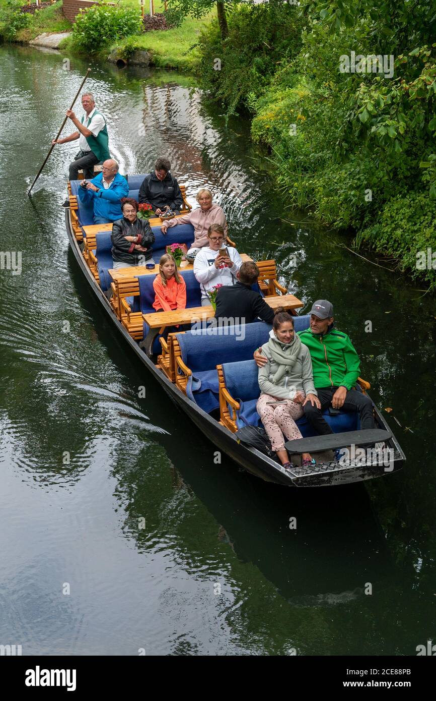 Luebben, Brandenburg / Germany - 28 August 2020: boatsman guiding tourists through the canals in the Spreewald region of Germany Stock Photo