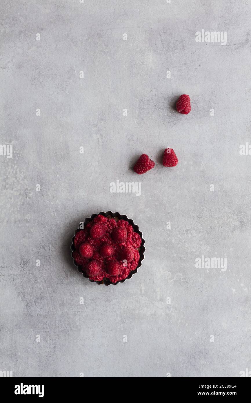 Top view of palatable pie with raspberry arranged on table Stock Photo