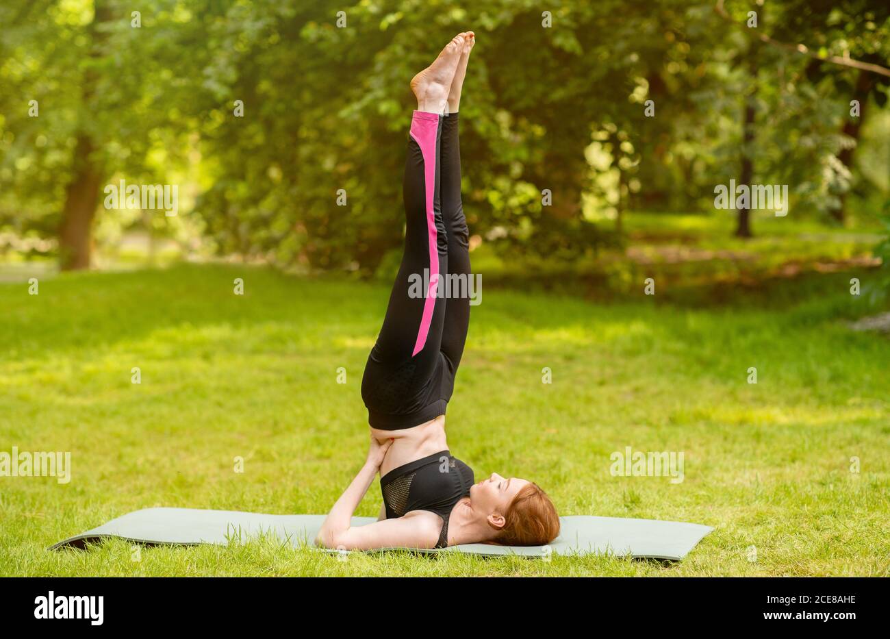 Yoga Supported Shoulderstand Pose - Salamba Sarvangasana on grad