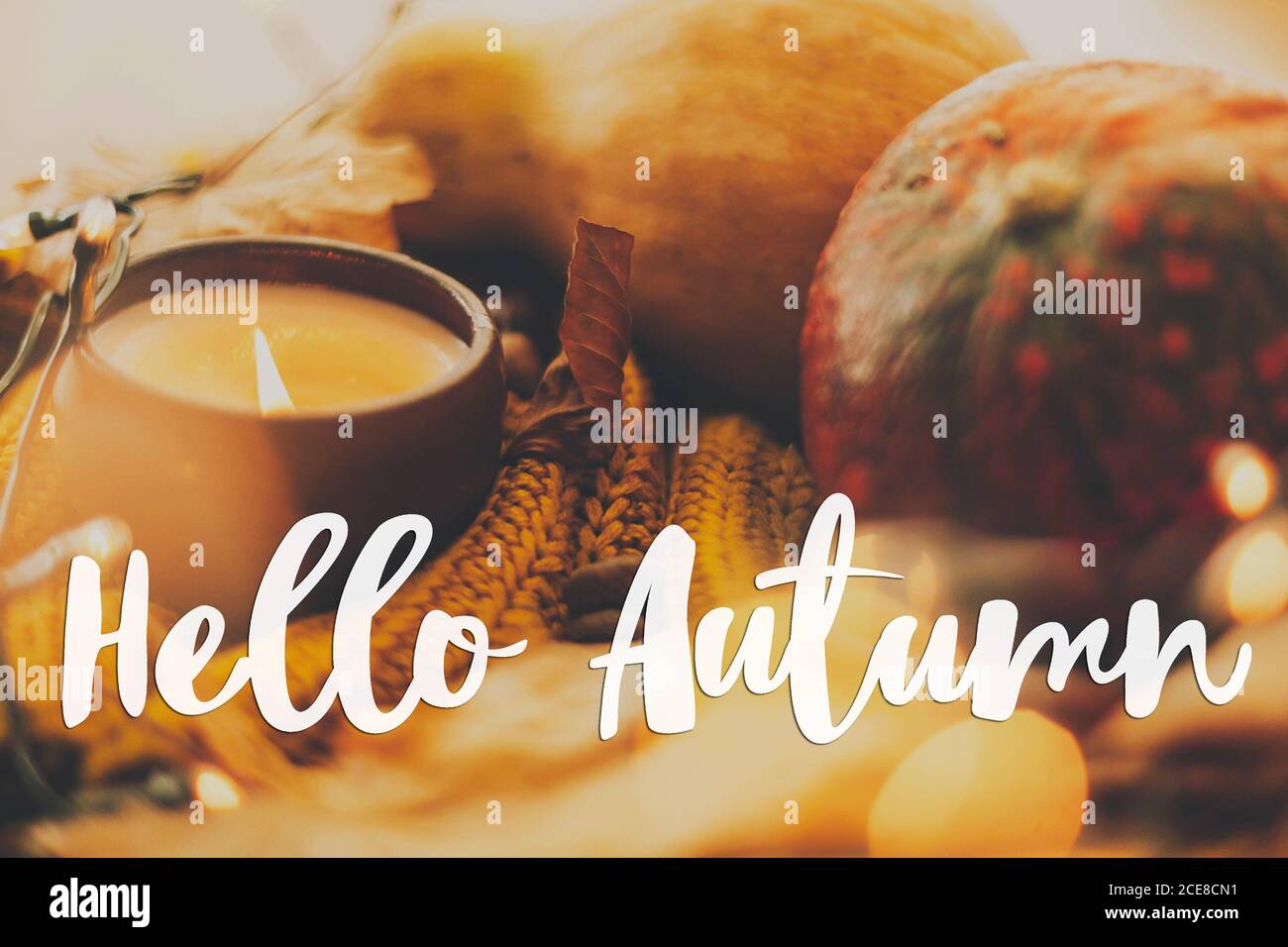 Hello autumn, hand written text on background of pumpkin, autumn leaves ...