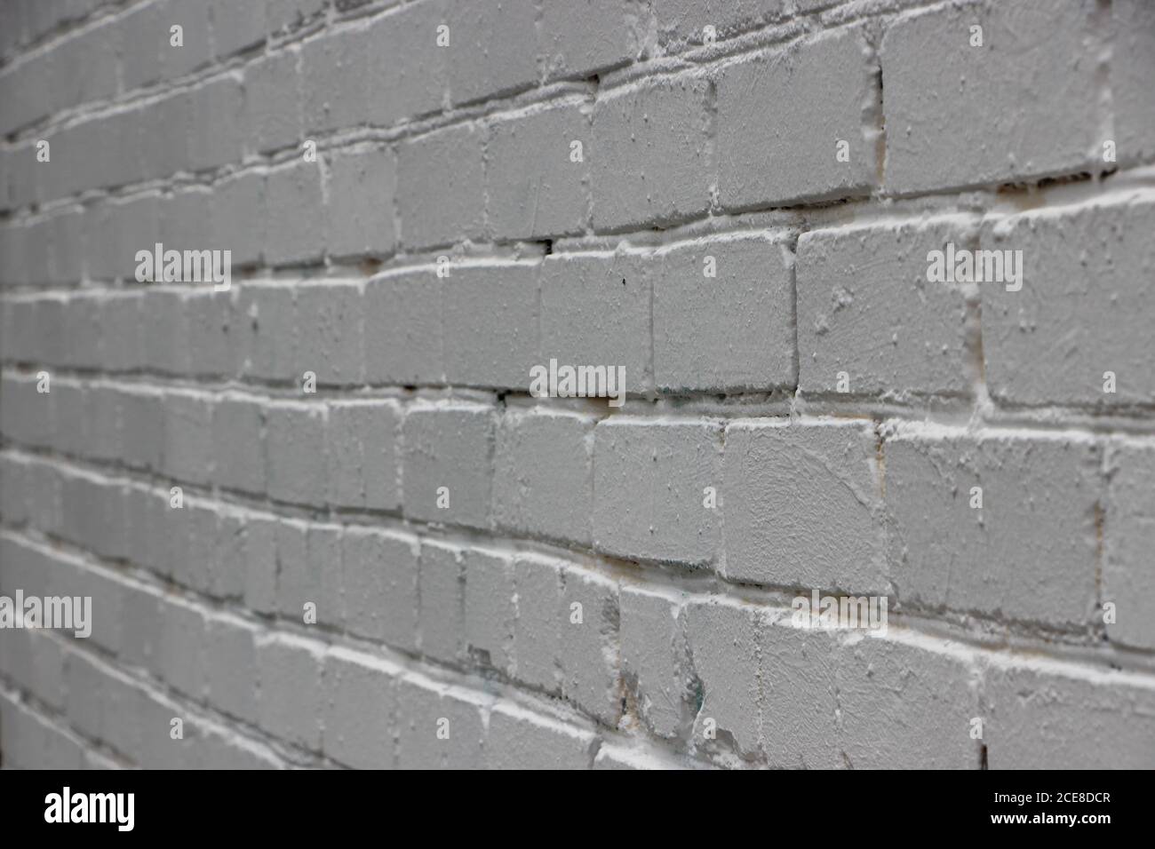 Old whitegrunge brick wall background in perspective Stock Photo