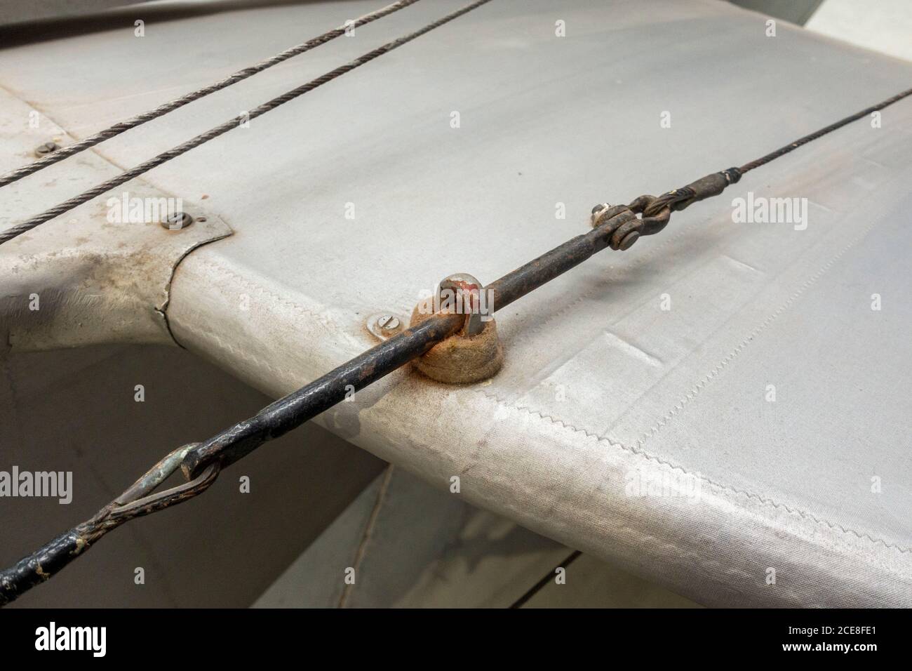Detail of wires connected to rear flaps on a De Havilland DH 82A Tiger Moth on display in the De Havilland Museum, London Colney, UK. Stock Photo