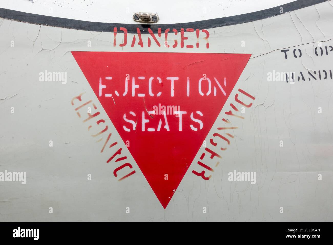 Ejection Seat warning notice on a De Havilland DH115 Vampire T.11 jet fighter on display in the De Havilland Museum, London Colney, UK. Stock Photo