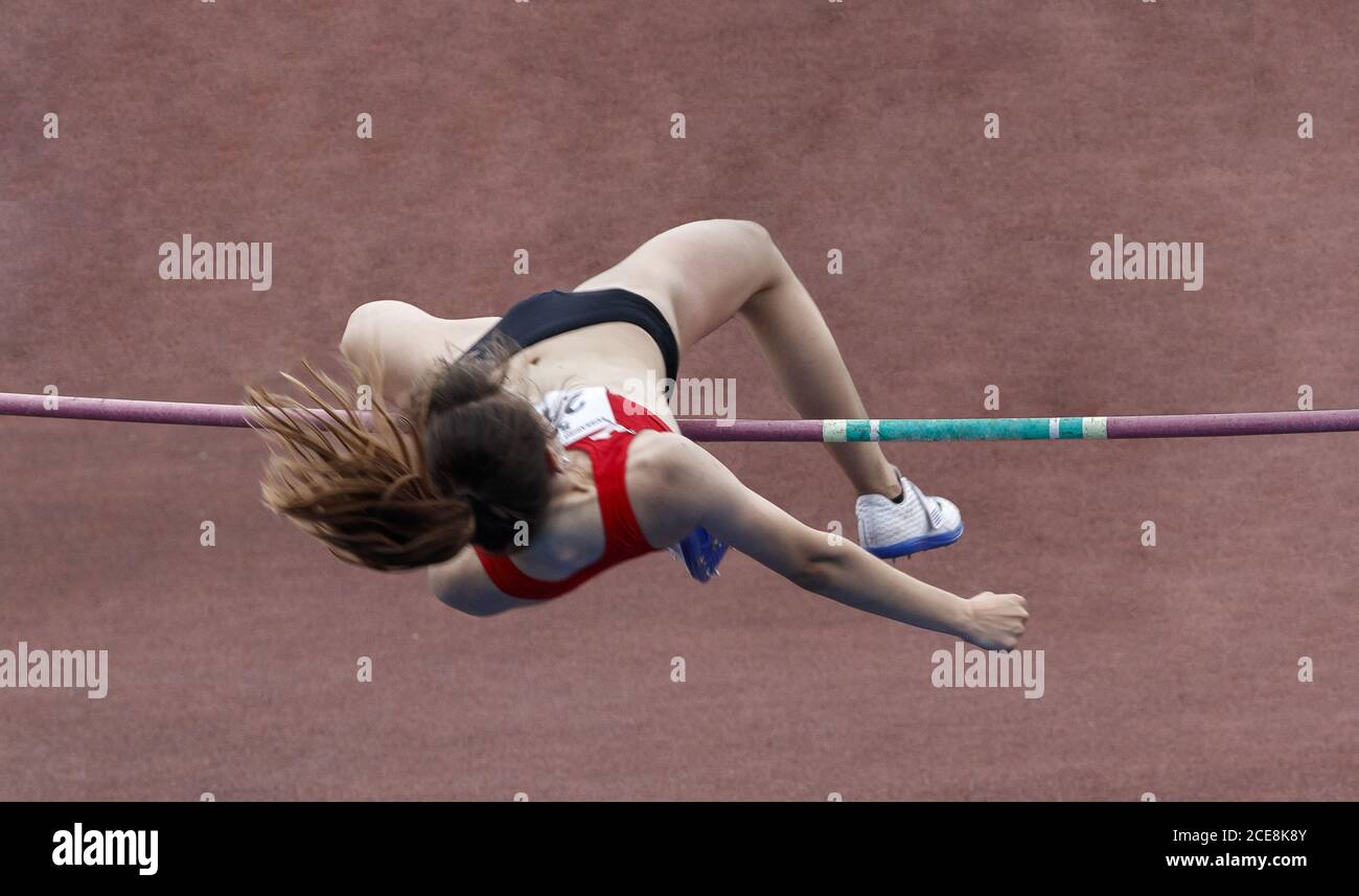 Athlete jumping over the bar in the pole vault sport Stock Photo Alamy