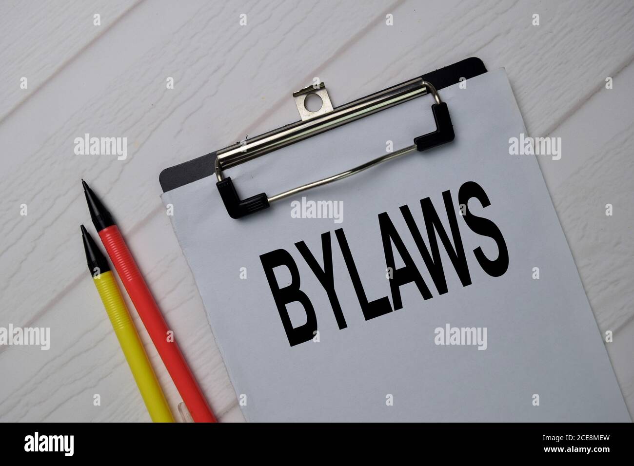 Bylaws write on a paperwork isolated on wooden table. Stock Photo