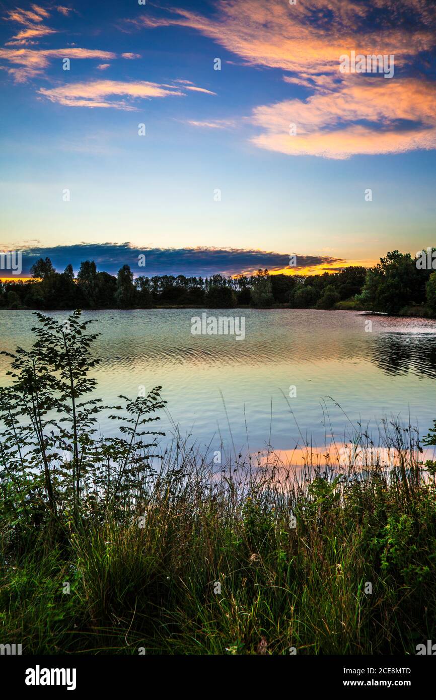 Late summer sunrise on one of the lakes at Cotswold Water Park. Stock Photo