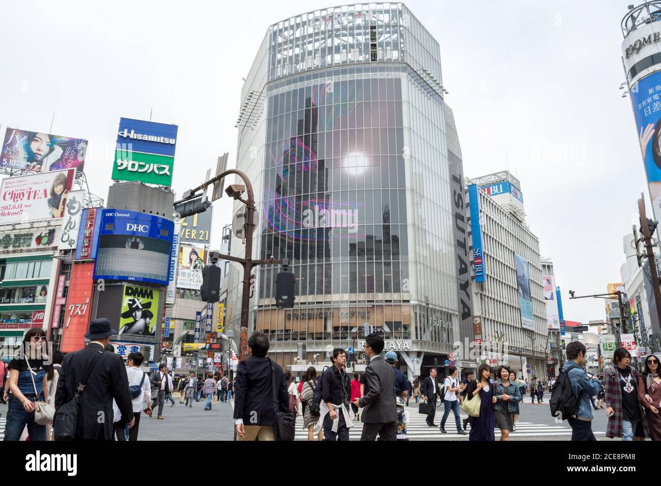 Shibuya, Tokyo, Japan - Shibuya scramble crossing. Many people at one of the busiest areas in the world. Crowded and full of advertising billboards. Stock Photo