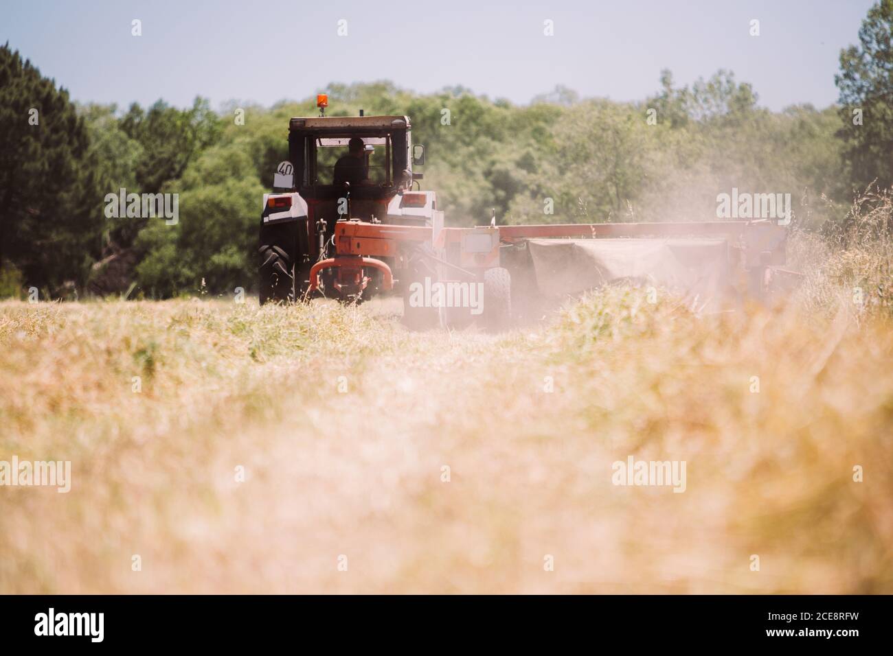 Man on tractor harvesting hay hi-res stock photography and images - Alamy