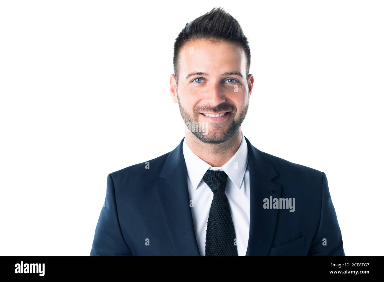 Studio portrait of confident businessman wearing suit and tie and ...