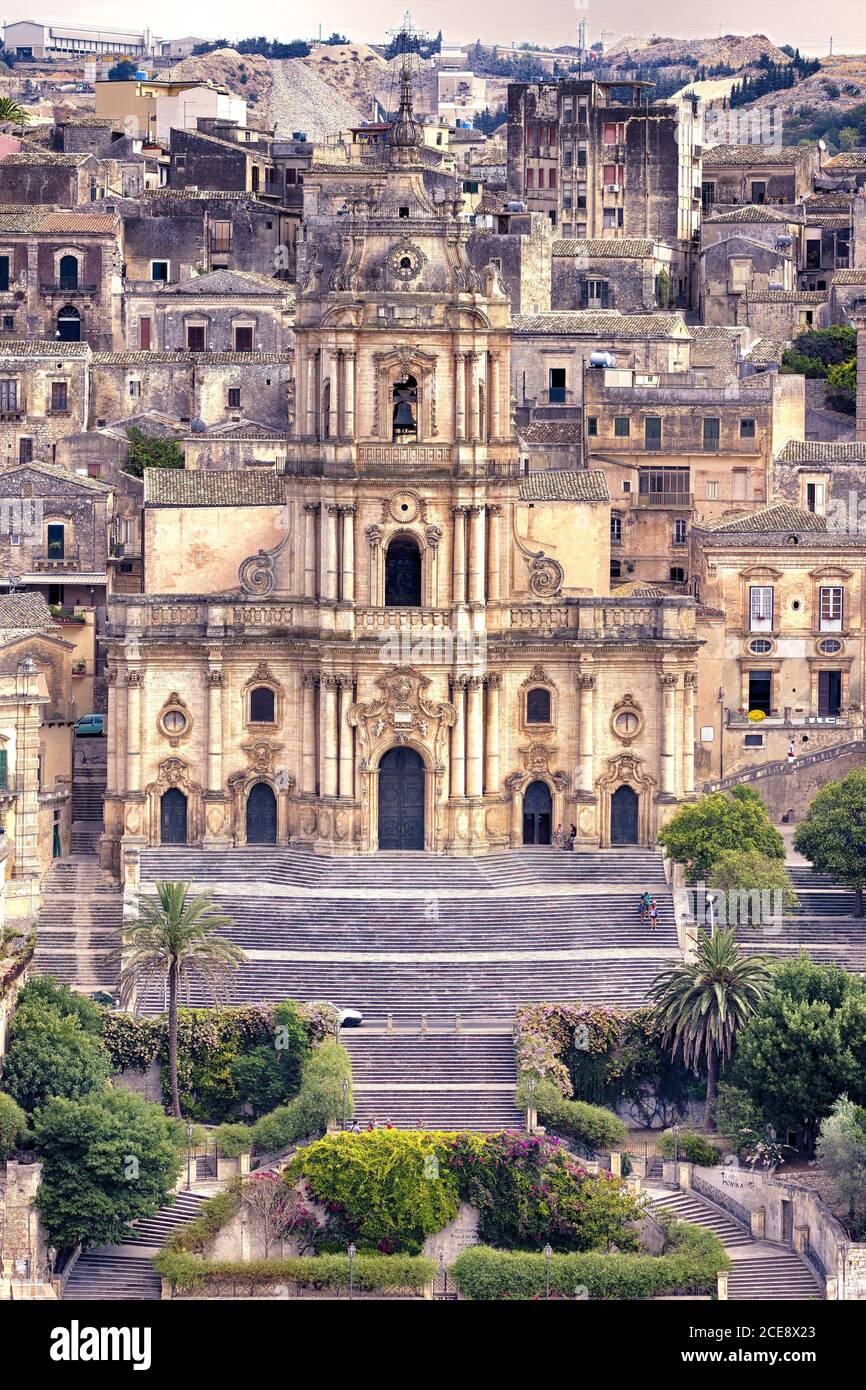 view of the Cathedral of San Giorgio with its staircase and gardens, near the city of Modica in the province of Ragusa, Sicily - Italy Stock Photo