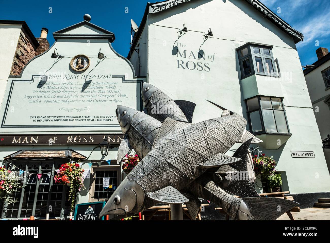 A sculpture of leaping salmon outside the Man of Ross Inn. Stock Photo