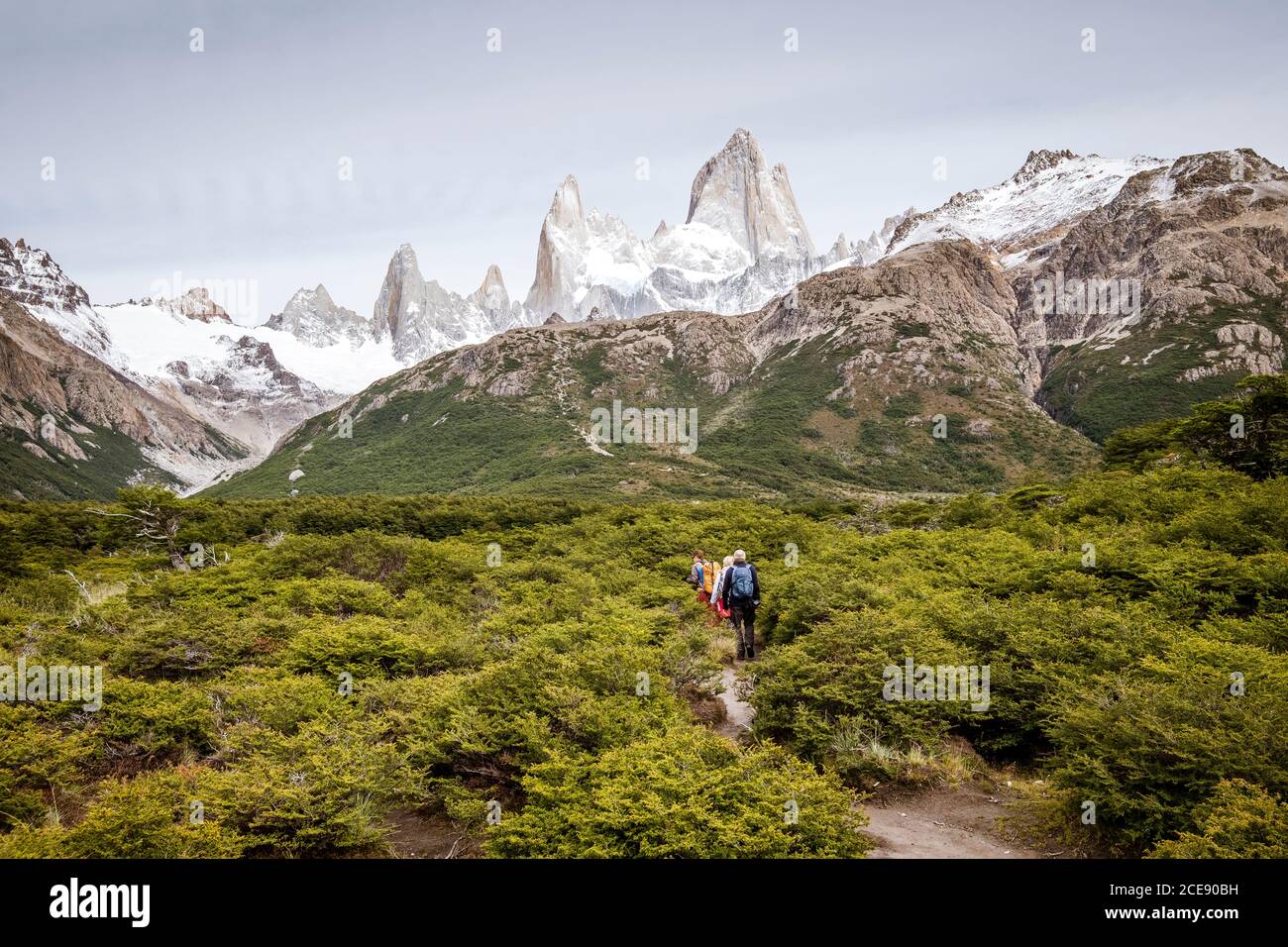 Hikers attempting to climb Fitz Roy mountain. Stock Photo