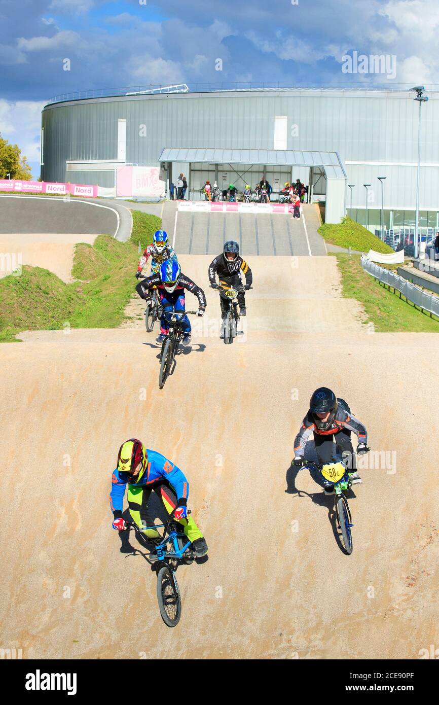 People learning how to ride a BMX at the velodrome cycling stadium in Roubaix (northern France) Stock Photo