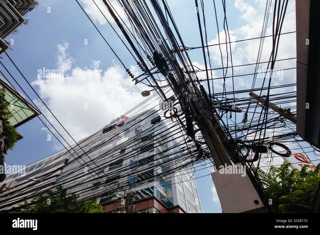 Crowded Power Pole in Thailand Stock Photo