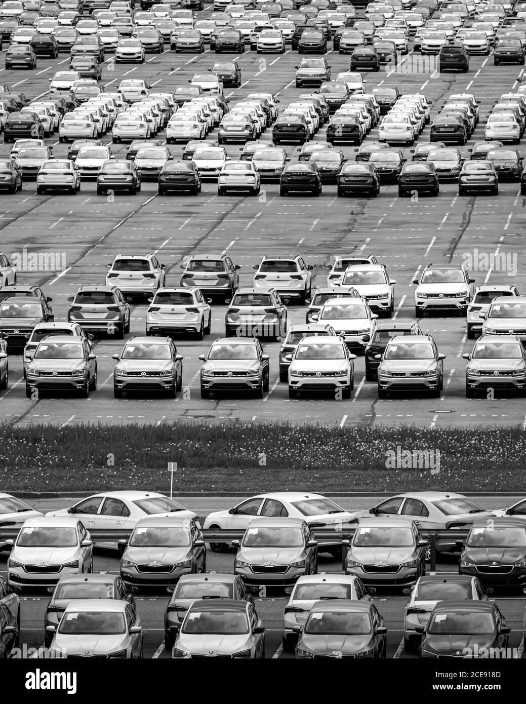 Volkswagen Group Rus, Russia, Kaluga - MAY 24, 2020: Rows of a new cars parked in a distribution center on a day in the spring, a car factory. Parking Stock Photo