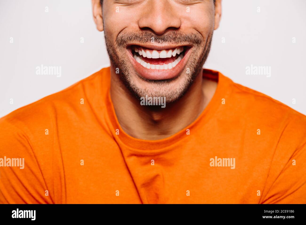 Person wearing orange shirt hi-res stock photography and images - Alamy