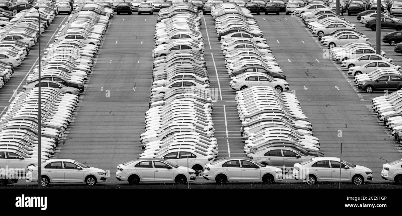 Volkswagen Group Rus, Russia, Kaluga - MAY 24, 2020: Rows of a new cars parked in a distribution center on a day in the spring, a car factory. Parking Stock Photo