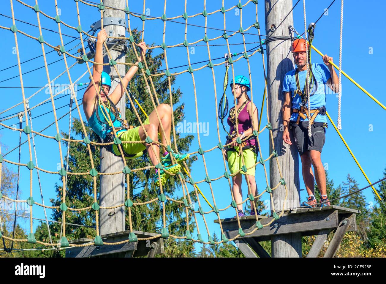 Climbing exercise in rope park Stock Photo