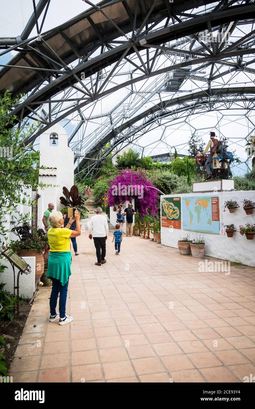 Visitors walking around the interior of the Mediterranean Biome at the Eden project complex in Cornwall. Stock Photo