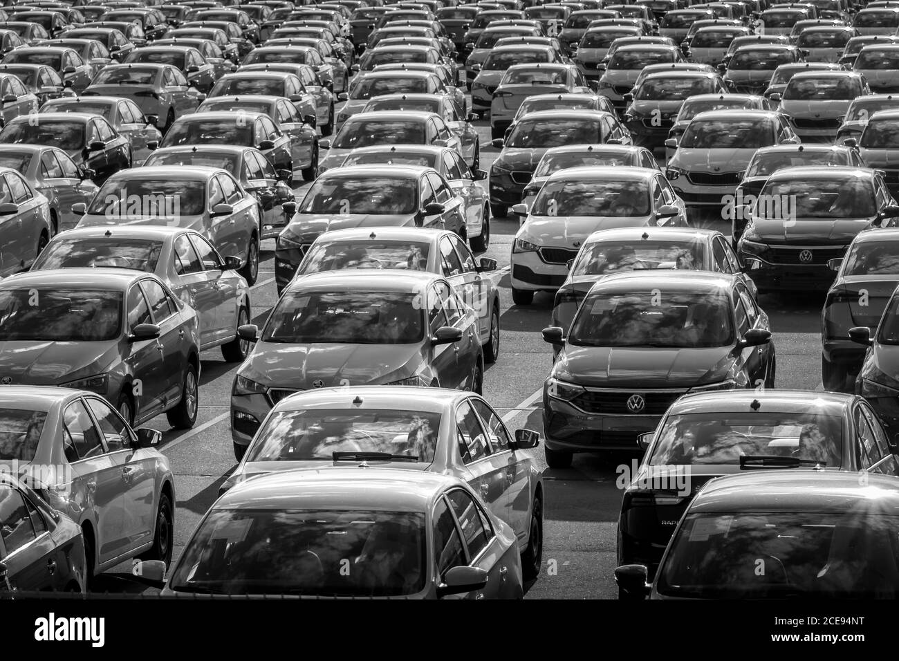 Volkswagen Group Rus, Russia, Kaluga - MAY 24, 2020: Rows of a new cars parked in a distribution center on a day in the spring, a car factory. Parking Stock Photo