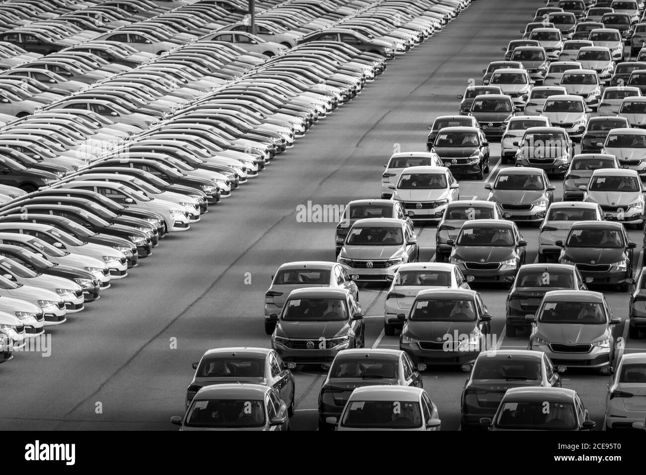 Volkswagen Group Rus, Russia, Kaluga - MAY 24, 2020: Rows of a new cars parked in a distribution center on a day in the spring, a car factory. Parking Stock Photo