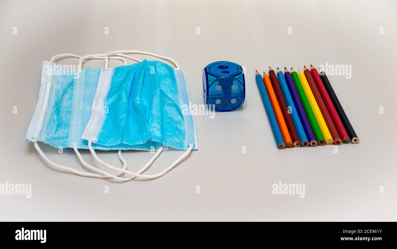 Back to school in new reality concept. School accessories and supplies. School supplies and COVID 19 prevention items. Back to school during pandemic. Stock Photo