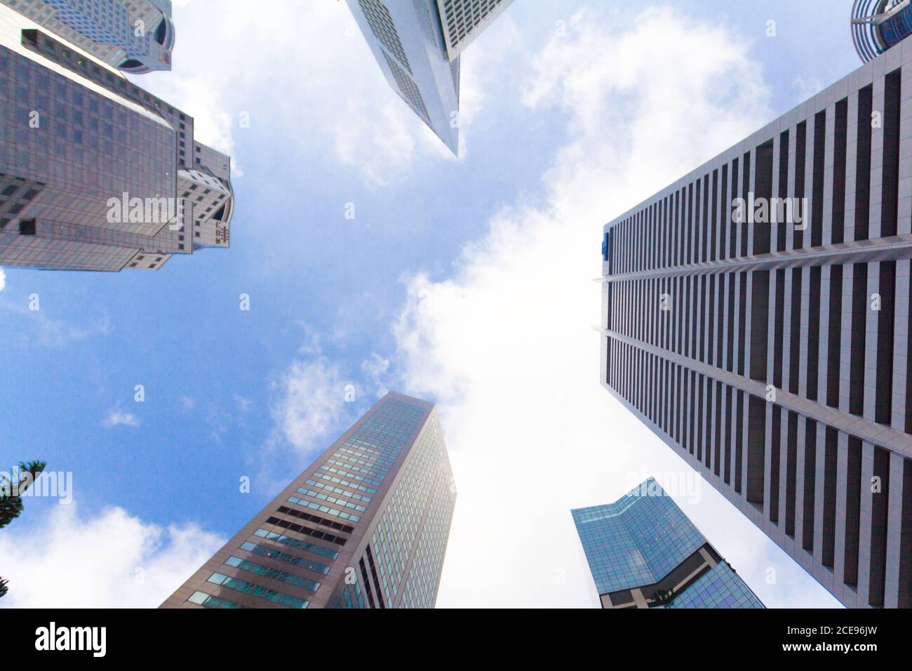Bottom view of Skyscraper and blue sky background Stock Photo - Alamy
