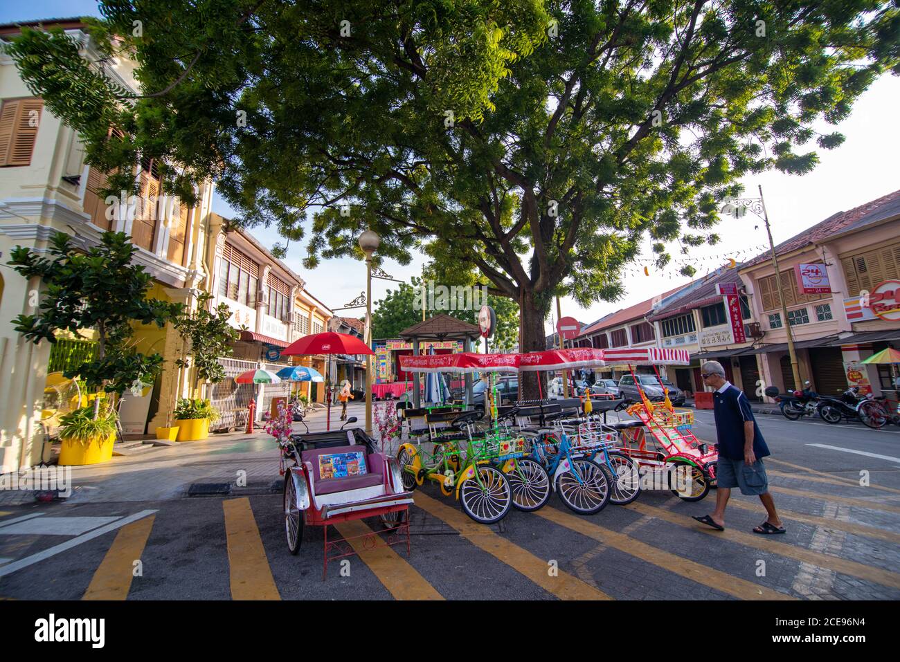 Georgetown, Penang/Malaysia - Sep 12 2016: A man walk across bicycle ...