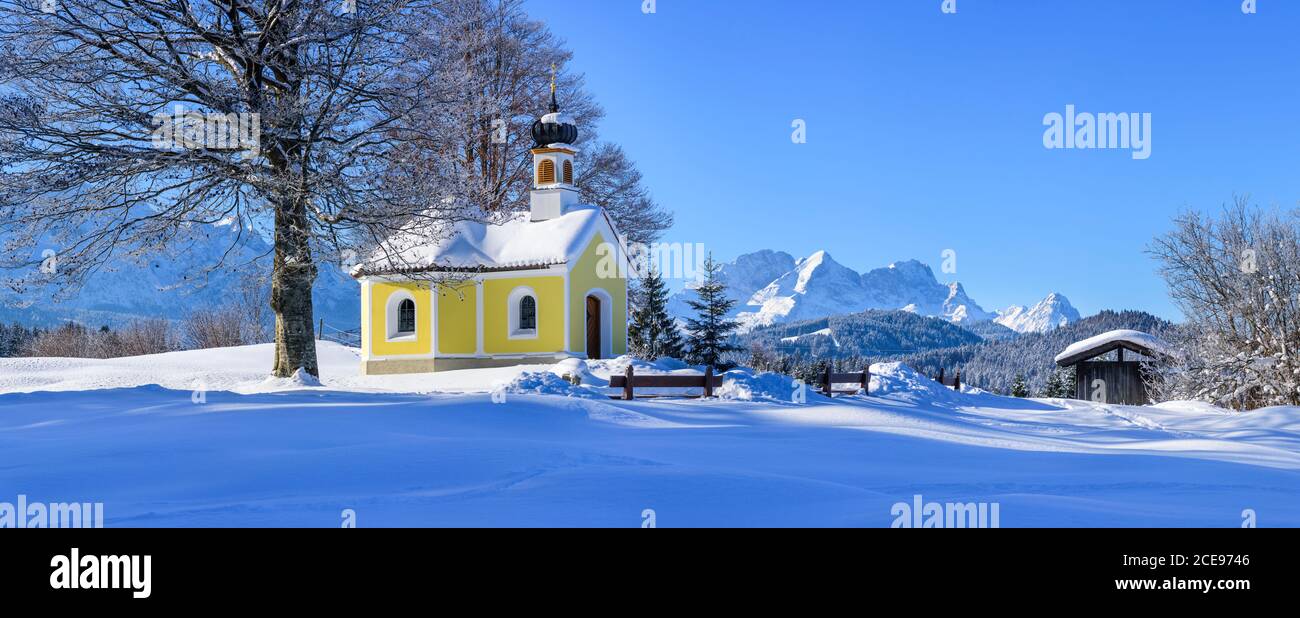 Little chapel in wintry landscape near Krün in bavarian alps Stock