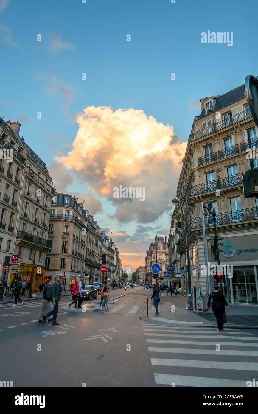 France. Summer day on an old street in Paris. Color cloud in blue sky Stock Photo