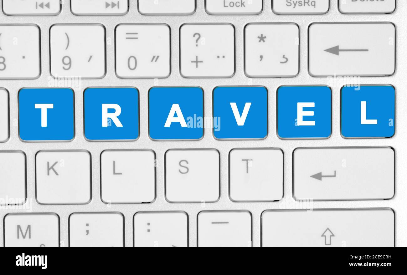 Travel word on computer keyboard close-up Stock Photo - Alamy