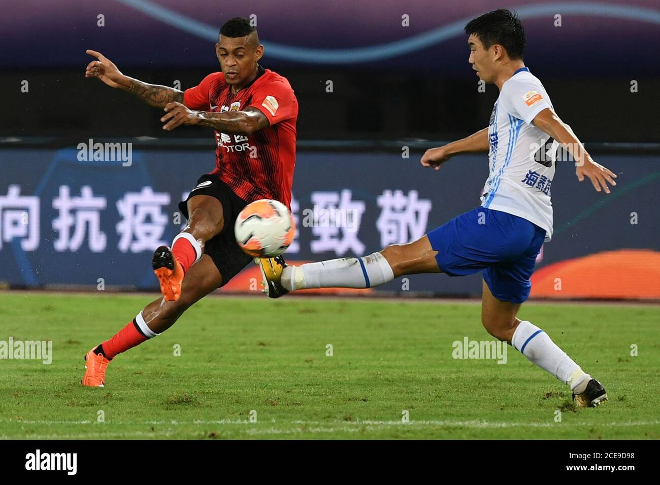 Suzhou, China's Jiangsu Province. 31st Aug, 2020. Ricardo Lopez (L) of Shanghai SIPG shoots the ball during the 8th round match between Shanghai SIPG and Tianjin TEDA at the postponed 2020 season Chinese Football Association Super League (CSL) Suzhou Division in Suzhou, east China's Jiangsu Province, Aug. 31, 2020. Credit: Han Yuqing/Xinhua/Alamy Live News Stock Photo
