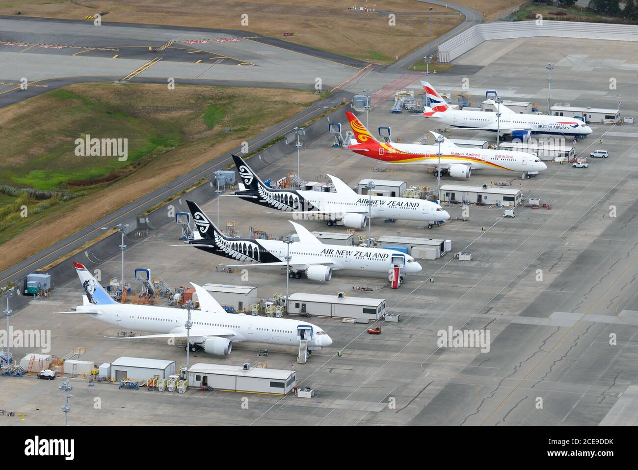Boeing 787 Dreamliners flight line outside the factory at Paine Field at Everett. B787 dreamiliner aircraft flightline lineup. Airplane production. Stock Photo