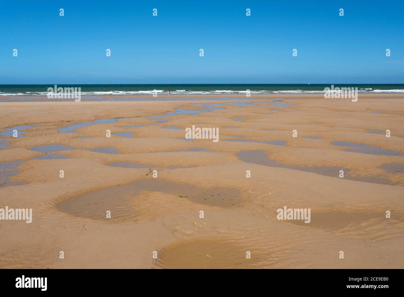 Tide pools in the sand on the beach at Holkham Bay, Holkham, Norfolk, UK Stock Photo