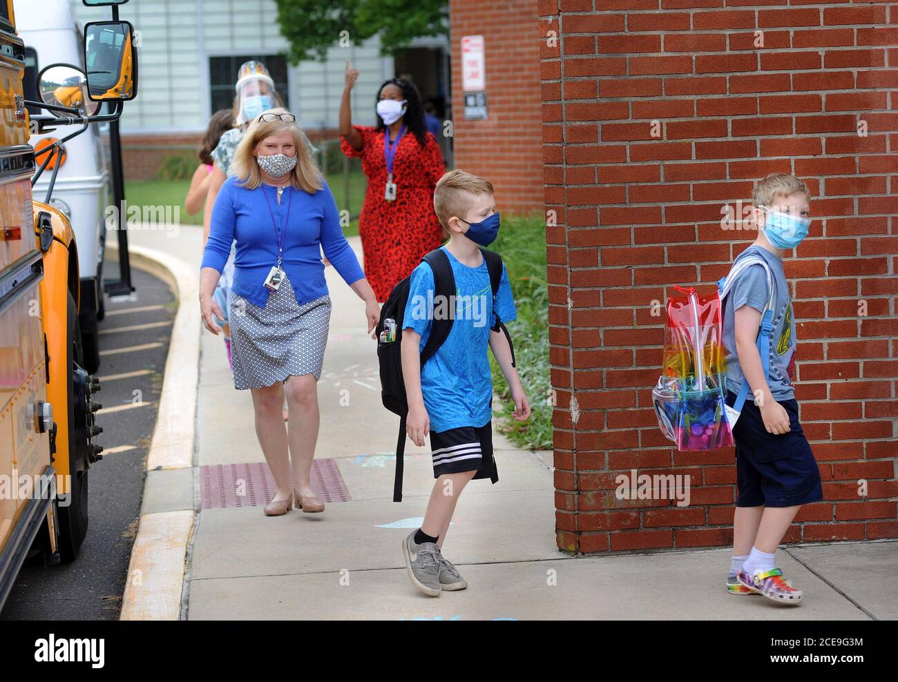 Tinicum Township, United States. 31st Aug, 2020. Principal Janet Link walks with students as they arrive for the first day of classes Monday, August 31, 2020 at Tinicum Elementary School in Tinicum Township, Pennsylvania. Credit: William Thomas Cain/Alamy Live News Stock Photo