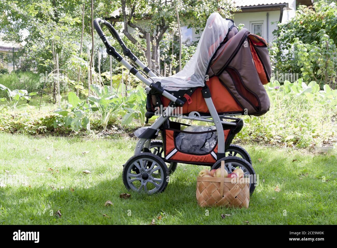Baby carriage and apples Stock Photo