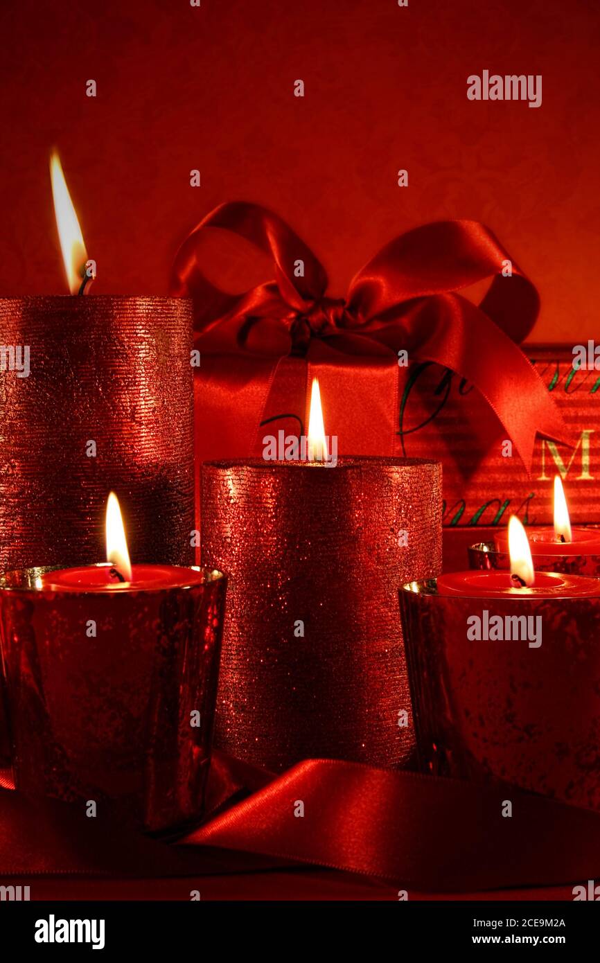 Red Christmas candles on vintage background Stock Photo